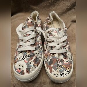 Isaac Mizrahi New York "Reesa" sneakers featuring a colorful dog print pattern. 